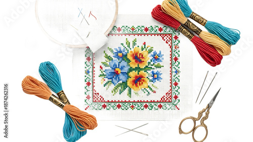 Stitching a vibrant floral needlepoint design with colorful threads and embroidery tools on a white background