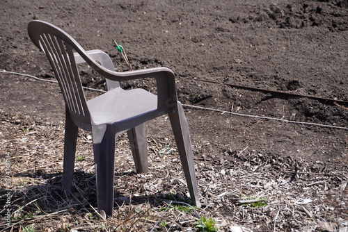 brown plastic chair in a garden
