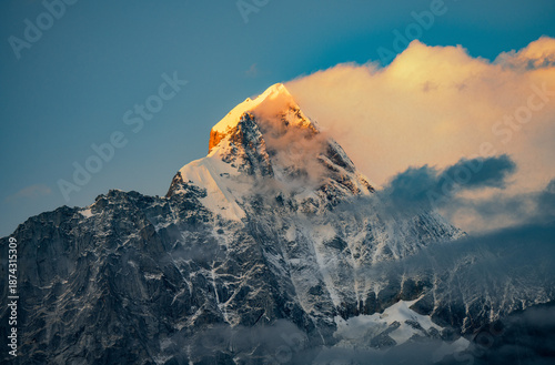 Bild auf Leinwand drone image of golden peak of Mount Siguniang in the setting sun