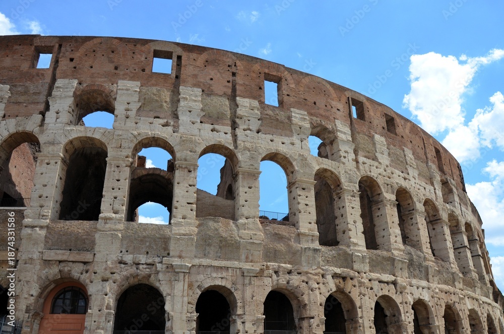 Obraz premium Rome, Italy 09.02.2019: Colosseum (Coliseum) is one of main travel attraction of Rome, Italy. Ancient Roman ruins of Colosseum, landscape of old Rome city, Italy.
