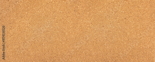 Cork board surface providing natural brown texture background