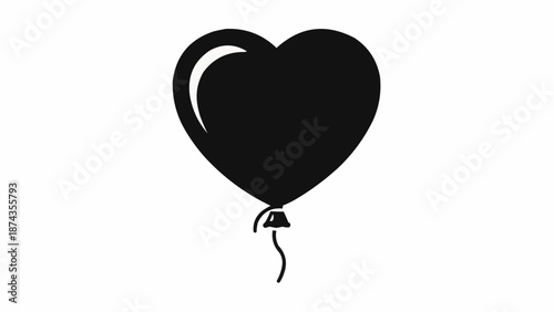 Black heart shaped balloon floating on white background.