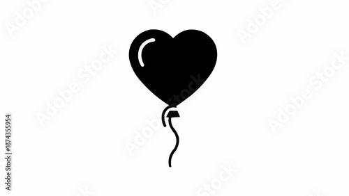 Black heart shaped balloon on white background.
