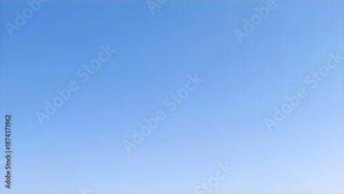 Clear blue sky background with soft gradient for graphic design and copy space.