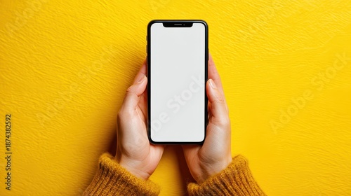 Hands holding smartphone on yellow background transparent