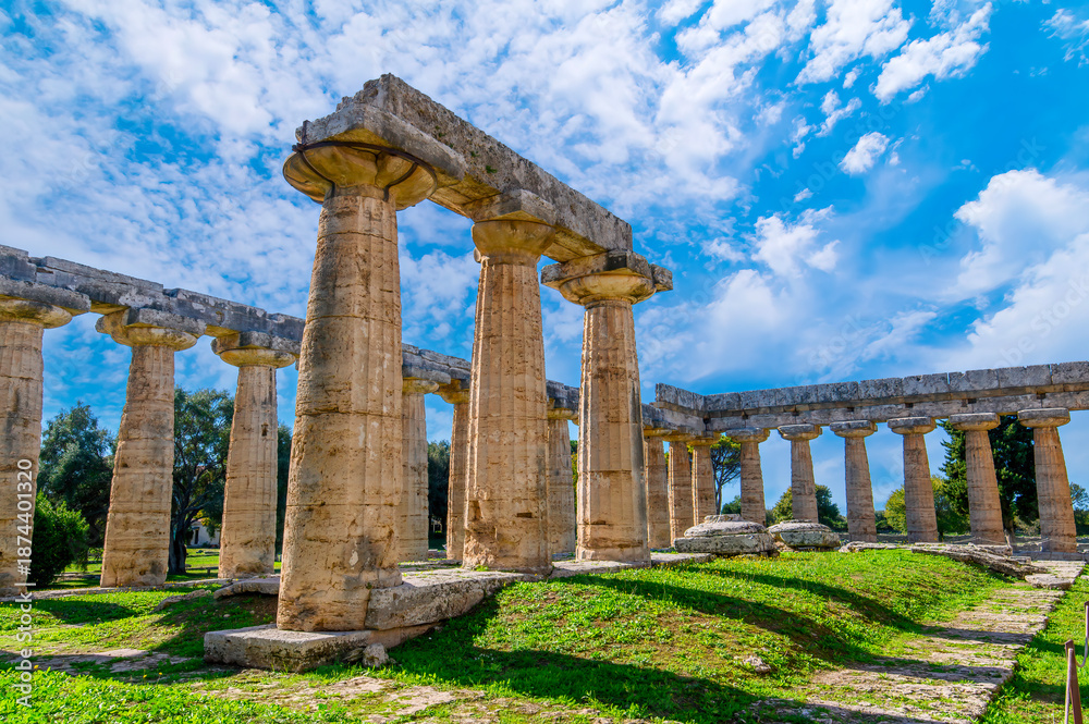 Fototapeta premium The ancient Greek temple of Hera in Paestum, Italy. Famous archaeological site of Paestum, Magna Graecia, ancient ruins.
