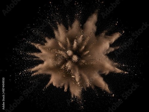 Brown powder explosion on black background
