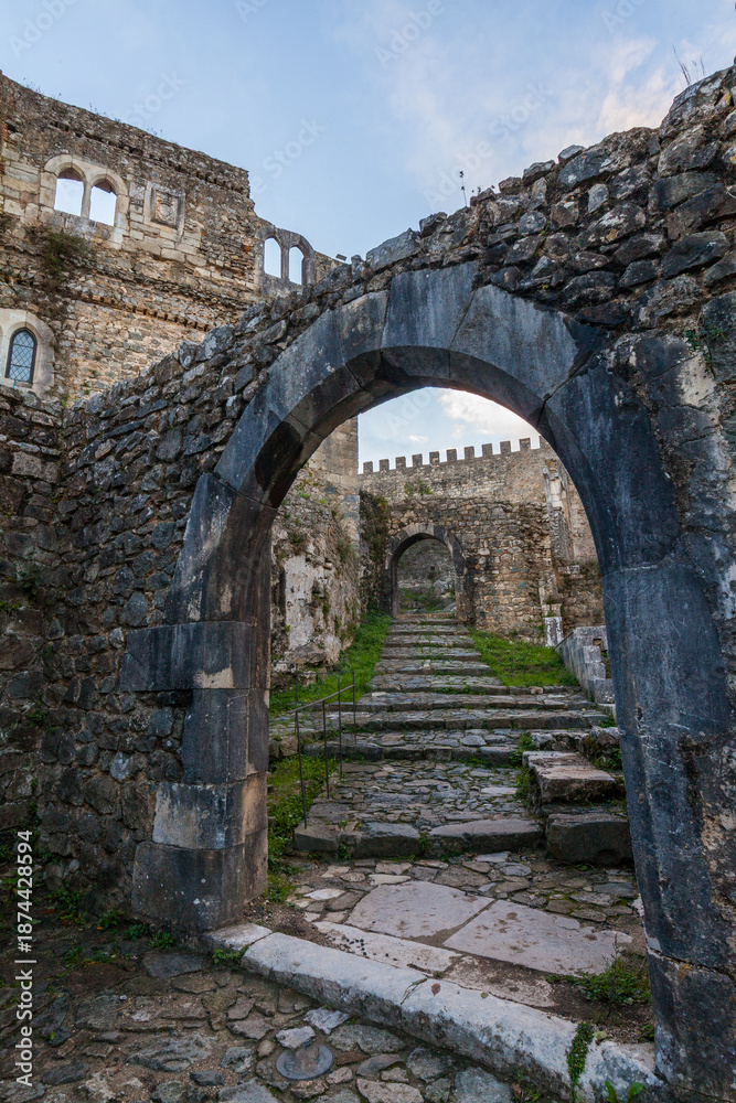 Fototapeta premium A low-angle view through a weathered stone archway