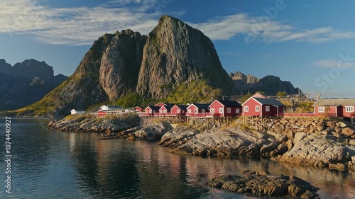 Traditional fishing village of Hamnoy in the Lofoten Islands, Norway, red wooden cabins, rugged coastline and Nordic nature. Aerial View