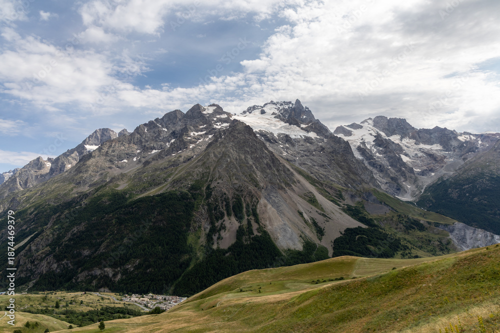 Fototapeta premium Mountain landscape in the Arves Massif, French Alps, with the iconic La Meije peak in the background.