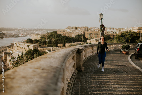 Woman jogging along the sce...