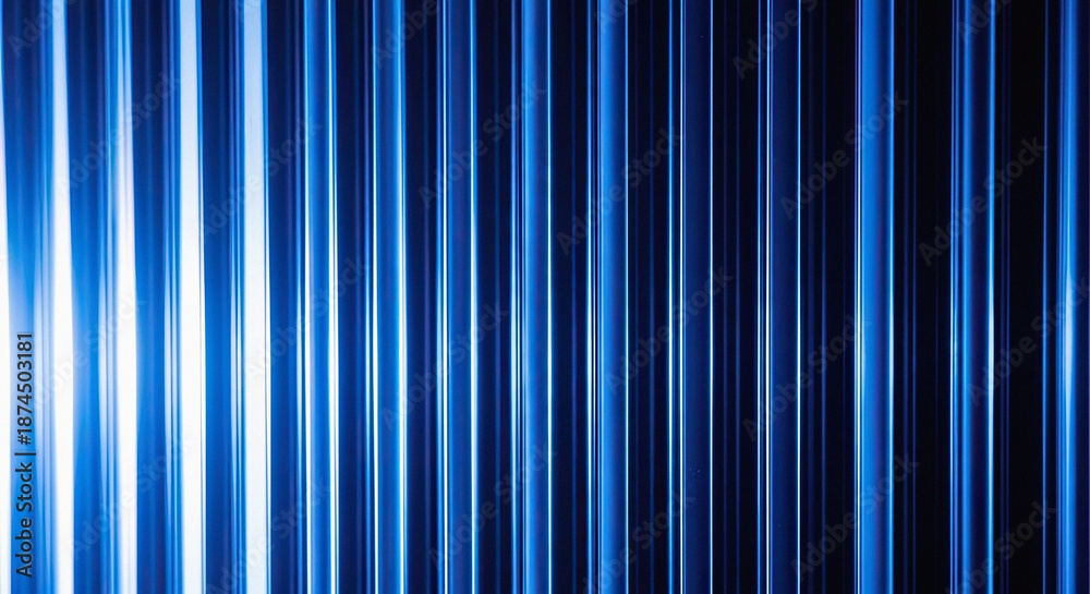 Obraz premium Vertical blue light stripes with gradient intensity on dark background