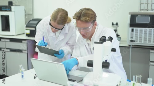 Scientists work together on research at a laboratory in the afternoon