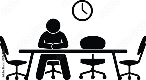 Person sitting alone at office desk waiting for interview