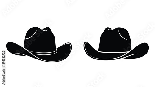 Two cowboy hats displayed side by side in a dark striking silhouette