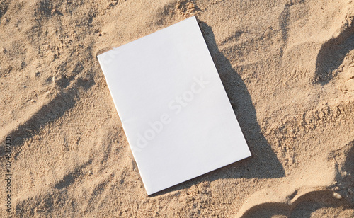 blank magazine mockup on sandy beach
