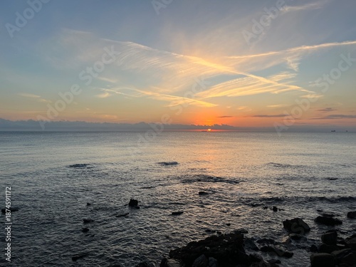 Sunset on a beach, with an orange colour. Very beautiful summer panorama. Golden hour.