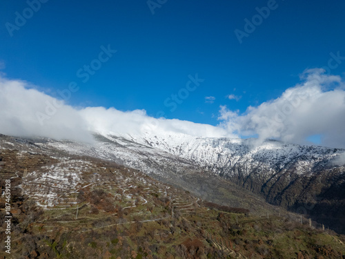 Snowy mountain peak with terraced slopes in Odemis, Turkiye