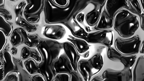 Abstract liquid metal surface with smooth organic shapes and high-gloss reflections, creating a futuristic, monochrome, and fluid metallic texture. Slow motion.