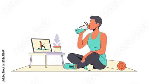 Woman hydrating during at-home workout session with online exercise class