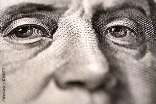 Fotografi Detail of Benjamin Franklin's face on a US $100 bill