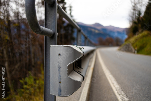 a guardrail on a mountain street background