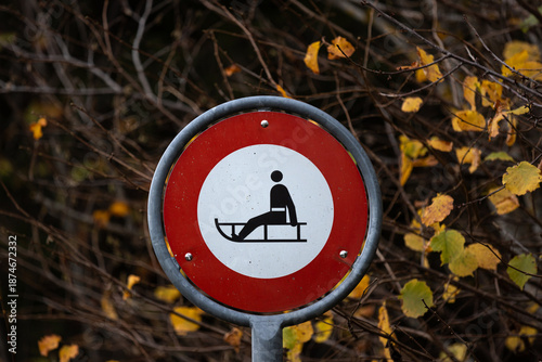 No sleds allowed sign on a path