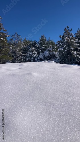 Pristine winter mountain views reveal snow-covered peaks and untouched alpine landscapes in the Sierra Nevada, Spain.