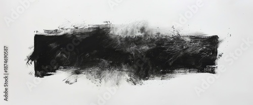 A long, dark, horizontal smear of charcoal with brushstrokes on a white background