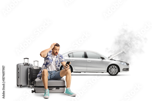 фотографія Man stranded with broken down car and luggage