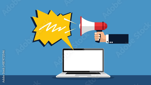 Hand holding megaphone near laptop computer.