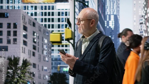 Wallpaper Mural Portrait of aging mature entrepreneur walking outdoors in metropolitan area, checking his phone among street people and urban crowd. Everyday movement, business culture and city life. Camera B. Torontodigital.ca