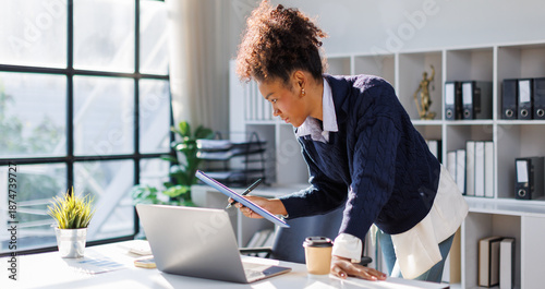 Принти на полотні Business in afro hair discussing financial reports and marketing charts during c