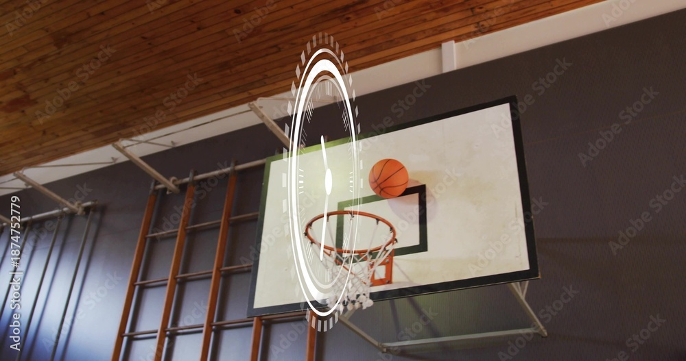 Fototapeta premium Showing basketball backboard and rim with ball perched in gymnasium, with AR HUD overlay