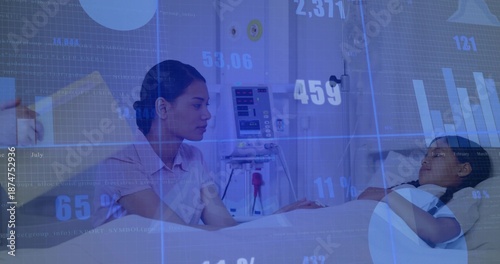 Holding child's hand, caregiver in collared shirt leaning forward at hospital bed, IV pump visible