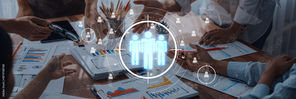 © InfiniteFlow - Team members engage in a collaborative meeting with digital tools. The image showcases hands working together, highlighting teamwork and communication in a business environment. Trope