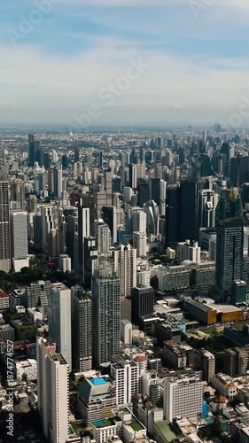 Modern city view showcasing skyscrapers, green spaces, and developed urban areas. Bangkok, Thailand.