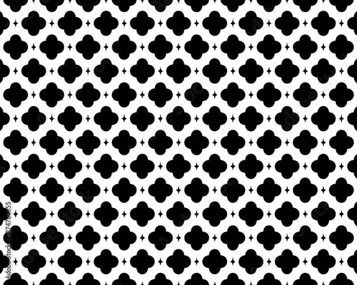 A seamless black and white geometric pattern featuring a repeating design of interconnected shapes