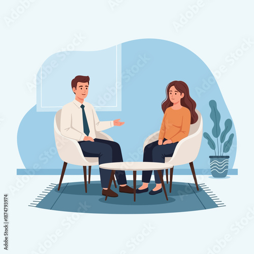 Man and woman engaged in a professional discussion or therapy session.