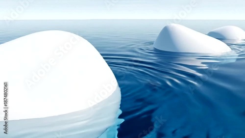 Icebergs floating in the ocean water.
