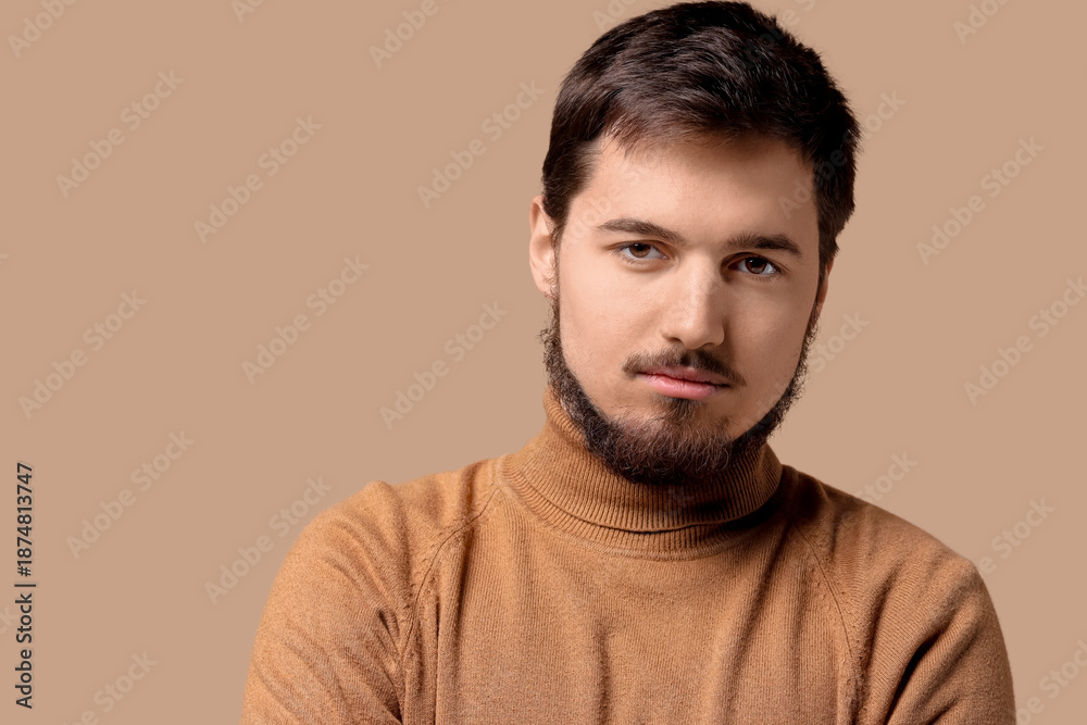 Obraz premium Portrait of handsome bearded man on beige background, closeup