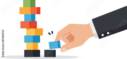 Building blocks tower with a hand placing block