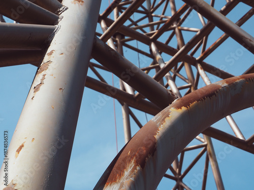 Large rusted steel structure showing raw industrial strength and weathered texture. The corrosion and rough metal surface tell a story of time, decay, and resilience. 