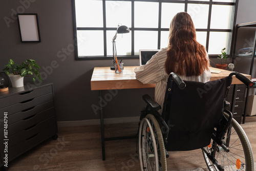 Young woman in wheelchair w...