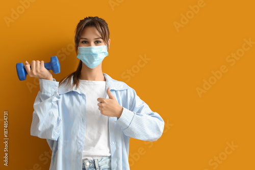 Young woman in medical mask...