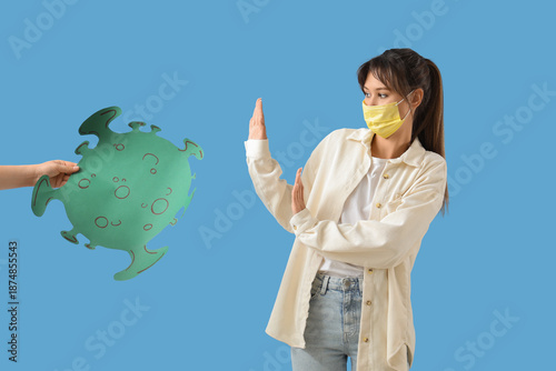 Young woman in medical mask...