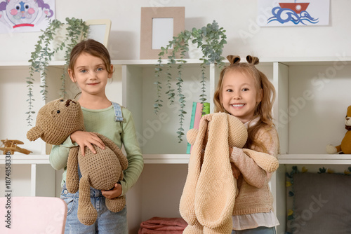 Cute little girls with toys...