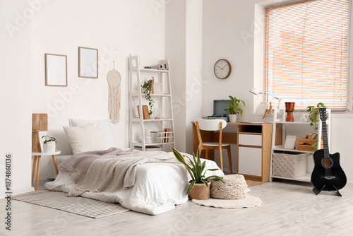 Interior of light bedroom w...