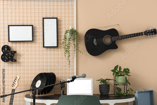 Workplace with guitar on be...