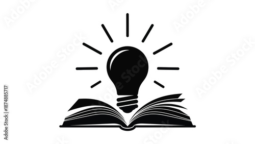 a lightbulb sitting on an open book with rays of light emanating from it